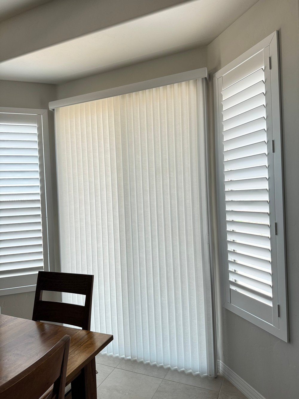 Top-Rate Custom Wood Shutters with Vertical Honeycomb Shades on N Tombaugh Ln in Green Valley, AZ